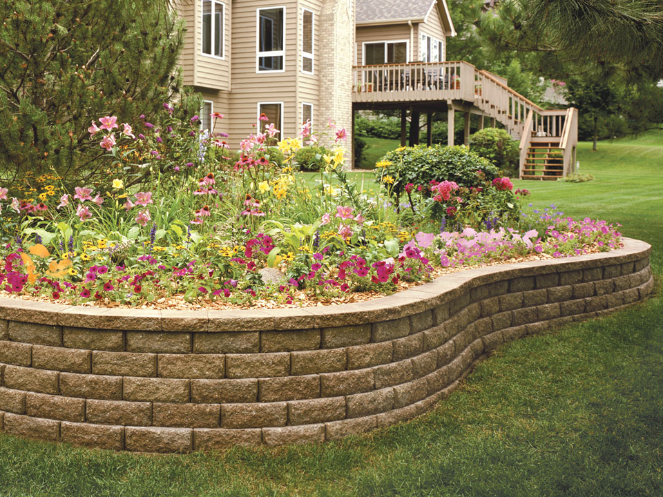 Close view of raised concrete block planter made from Aspen Stone retaining walls