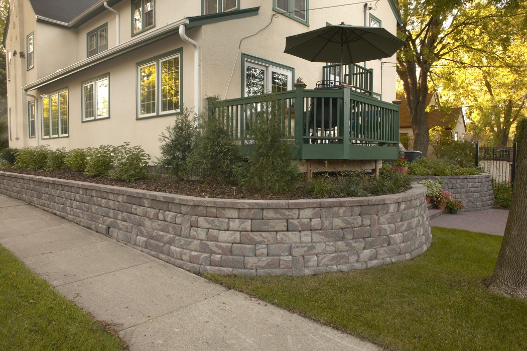 Residential home featuring a perimeter of raised planters made from Bayfield retaining walls