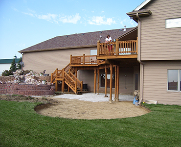 Residential backyard before installing Highland Stone retaining walls and stone paver walkway