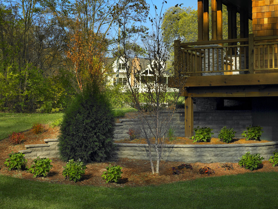 Wooden porch overlooking terraced raised ChiselWall retaining wall concrete block planters 