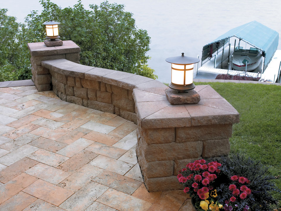Waterside Highland Stone freestanding concrete block wall and columns with bronze lanterns
