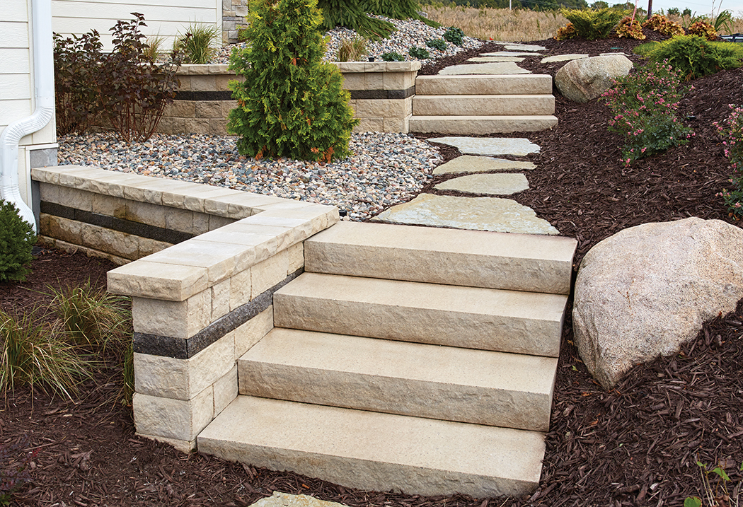 Landings Step Unit and flagstone walkway flanked by Matiz concrete block retaining walls. 