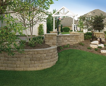 Anchor Wall Highland Stone curved retaining walls and planting areas